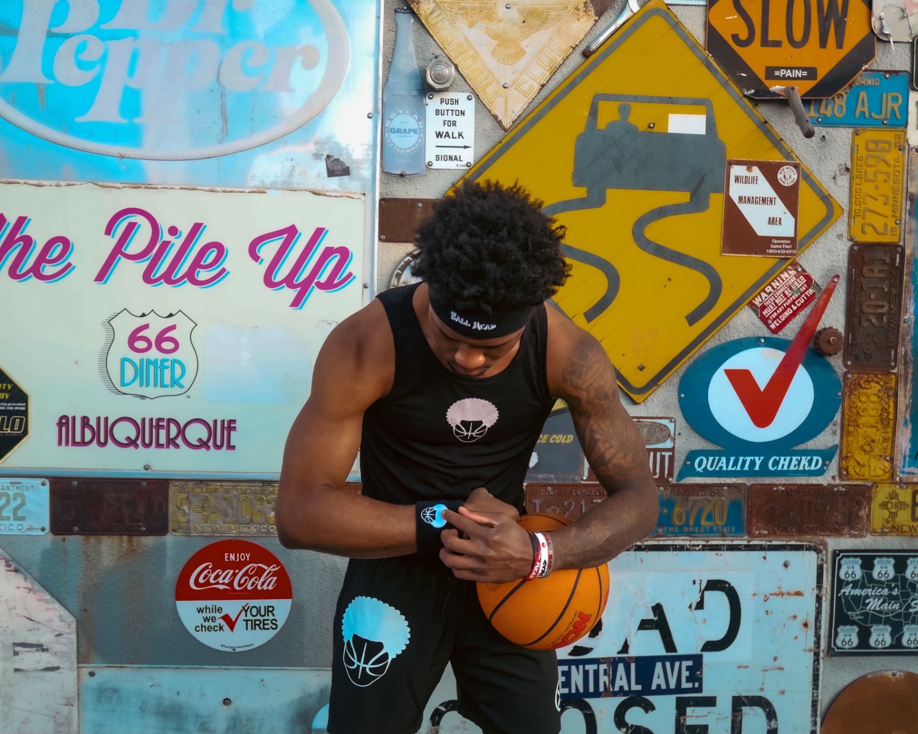Black BallHead tank top with white afro basketball logo and Romans 8:31
