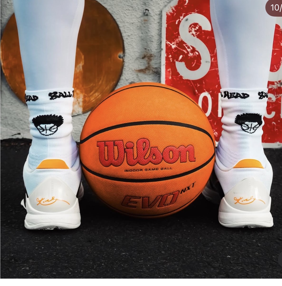 White Ball Head Hoops crew socks with woven logo and wordmark beside a basketball